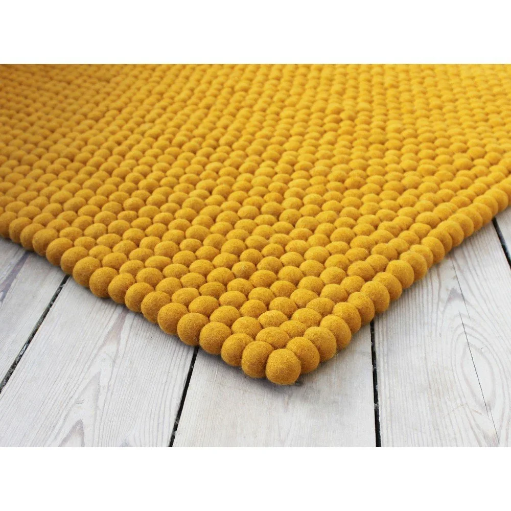 Hořčicově žlutý kuličkový vlněný koberec Wooldot Ball Rugs, ⌀ 120 x 180 cm v:1340943